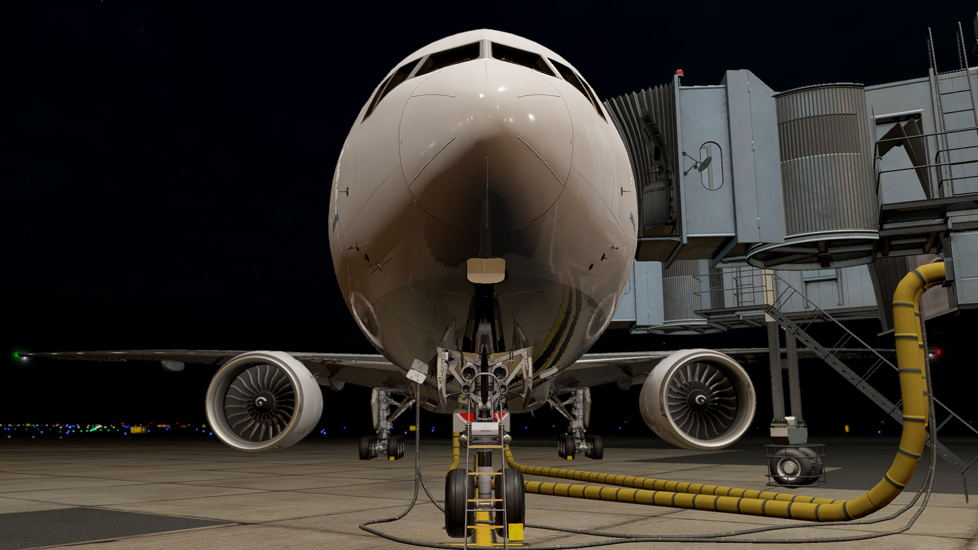 vTHY Boeing 777 parked at the gate at night